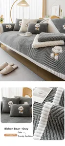 Close-up of grey teddy fleece sofa cushion with 3D Bichon Frise embroidery texture