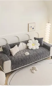 Detail of dark grey heavy plush sofa cover with pebble embossed texture and matching pillow