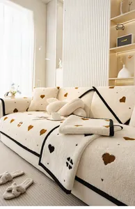 Plush chenille sofa mat with brown heart patterns in a cozy minimalist living room