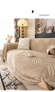Dettaglio copridivano in velluto di flanella beige con motivi geometrici testurizzati