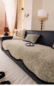 Detailed view of textured chenille sofa cover with wavy black trim and oat woven fabric