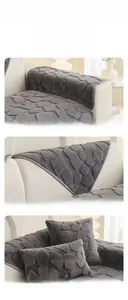 Detailed close-up of grey rabbit plush sofa cover with geometric diamond texture and cushions