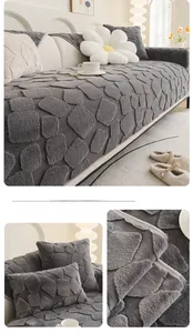 Detail view of dark grey faux rabbit fur sofa cover with textured square embossed pattern