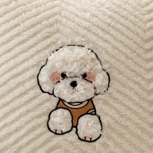 Plush beige sofa cushion with textured wave pattern and cute cartoon dog embroidery