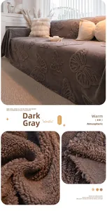 Detail of grey velvet sofa cover with embossed butterfly pattern and thick plush texture