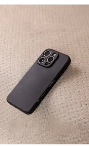 Textured fabric phone case with soft anti-slip silicone particles and wear-resistant finish