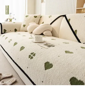 Close-up of soft plush sofa cover with green heart patterns and textured teddy fleece