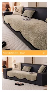 Detail of green chenille sofa cover with wavy black trim and heavy textured weave