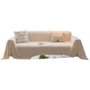 Creamy white sofa cover featuring embossed butterfly patterns and thick knitted texture