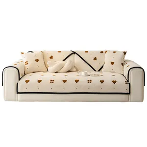 Thick plush sofa cover with heart pattern and non-slip backing for living room
