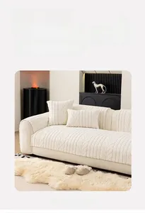 Detailed view of cream white plush sofa cover with elegant leaf vein pattern texture