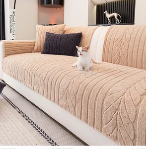 Detail of camel plush sofa cover with elegant leaf pattern texture and soft warm fabric
