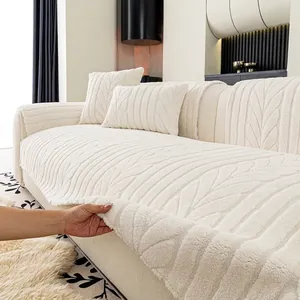 Thickened plush sofa cover in cream white with embossed leaf texture and matching pillow