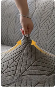Macro detail of dark grey polar fleece sofa cover showing ultra high elasticity and leaf texture