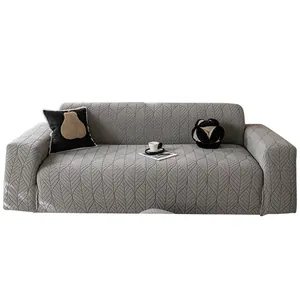 Elastic gray sofa cover with embossed leaf pattern in a modern minimalist style
