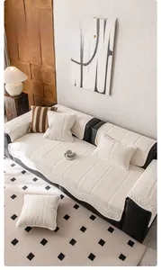 Close-up of white chenille sofa cover showing 3D herringbone texture and soft fabric