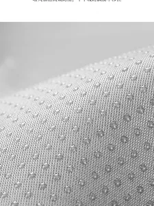 Detail of anti-slip granules on teddy velvet bay window mat for stable positioning