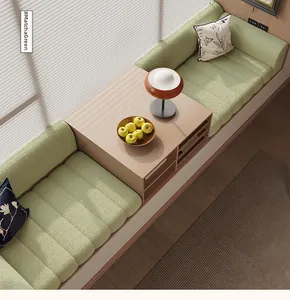 Detail of matcha green quilted bay window cushion with integrated wooden storage side table