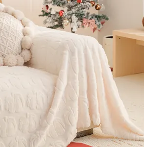 Close-up of thick cream faux rabbit fur sofa cover with 3D embossed floral texture