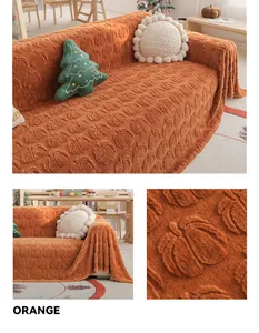 Detail of orange rabbit fur sofa cover featuring embossed pumpkin texture and soft fabric
