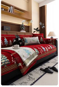 Detailed Christmas chenille sofa cover with festive red reindeer and tree patterns