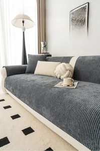 Detail of gray chenille sofa cushion with textured vertical stripes and thick fabric