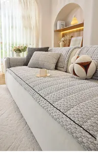 Detail of light gray corduroy sofa cushion featuring a non-slip textured granule fabric