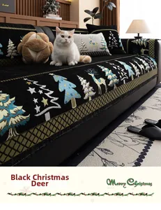 Detail of Christmas reindeer and tree pattern on thick black chenille sofa cover