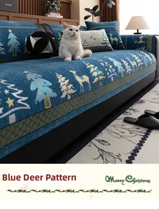 Detail of Christmas chenille sofa cover with blue reindeer pattern and festive decorations