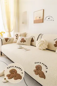 Close-up of thick sherpa sofa cover featuring cute puppy embroidery and plush texture