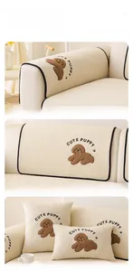 Detailed close-up of thick off-white teddy fleece sofa cover with cute puppy embroidery