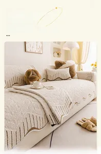 Detail of quilted plush sofa cover with wavy edges and durable machine washable fabric