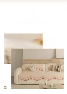Detail of soft cream cotton velvet sofa cover with decorative red wavy embroidery edges