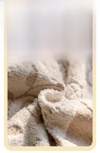 Close-up of plush diamond-quilted sofa cover fabric showing warm velvet texture