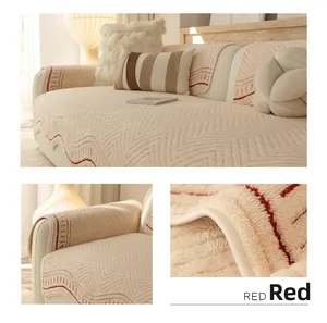 Close-up of beige quilted sofa cover with wavy patterns and red zigzag decorative edges