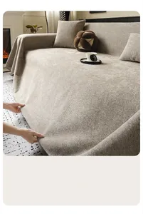 Close-up of heavy-duty beige chenille sofa cover with thick knit texture and soft drape