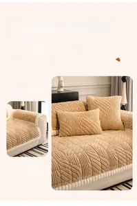 Detail of soft chenille sofa cover with 3D leaf texture and white pom-pom fringe edges