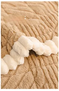 Detail of modern beige sofa cover featuring 3D wave texture and soft plush lace trim