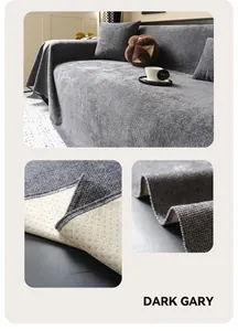 Detail of dark gray textured sofa cover with non-slip backing and hemmed edges