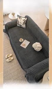 Detail of dark grey thickened plush sofa cover with modern 3D square texture