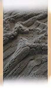 Macro detail of high-weight thick fleece sofa cover with embossed texture and anti-slip fabric