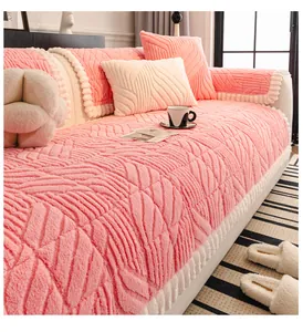 Close-up of pink plush sofa cover featuring leaf texture and white wavy edges