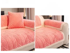 Pink plush sofa cover detail showing wavy texture and white pom-pom fringe trim