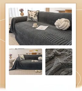 Detailed macro view of dark gray textured velvet sofa cover with thick striped knit pattern