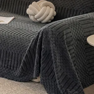 Thick dark grey textured sofa cover throw with elegant drape and vertical ribbed pattern