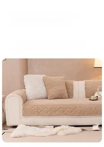 Detail of plush beige sofa cover with geometric embossed patterns and soft corded edges
