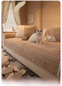 Close-up of thick plush sofa cover featuring 3D leaf texture and matching pillows
