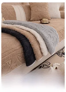 Detailed view of thick plush sofa cover with 3D embossed texture in neutral tones