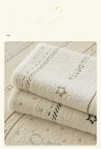Detail of plush off-white sofa cover with star pattern and soft sherpa texture