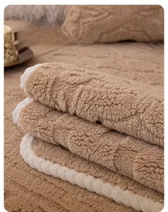 Close-up of thick plush camel sofa cover with white stitched edges and soft fleece texture